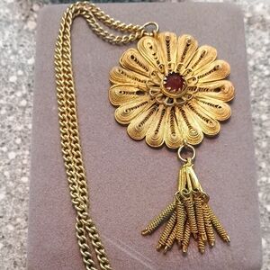 Intricate Gold Filigree Necklace with Red Gem